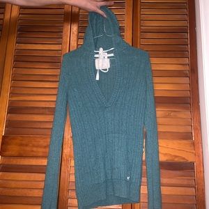 Long sleeve, low cut, sweater with hood